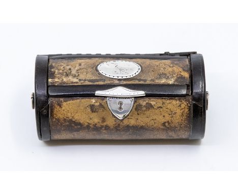 An early 19th century silver-mounted leather cylindrical snuff box, he hinged cover applied with a crested silver plaque, sil