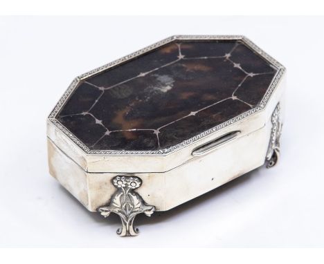 A George V silver and tortoiseshell octagonal Trinket Box, the hinged lid inset inlaid tortoiseshell, the scroll supports cas