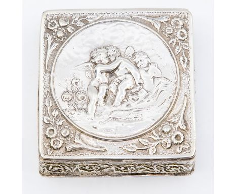 An early 20th Century silver square Trinket Box, the hinged lid embossed cherubs with floral branches embossed to the corners