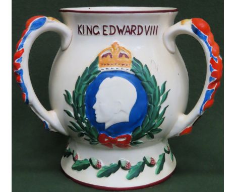 Edward VIII ceramic three handled loving cup. Approx. 22cms H

musical section deficient. crazing throughout. chip to base 