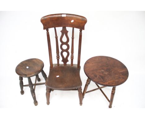 A vintage wooden stool, circular table and a chair. The table raised on turned supports with 'x' stretchers, H46cm, Diameter 