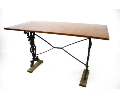 A vintage rectangular pub table. With cast iron supports and stretchers, L121cm x D60cm x H73cm