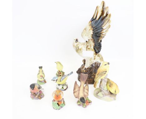 Eight porcelain bird figurines. Including seven Royal Worcester models, and an eagle. Max. H30cm