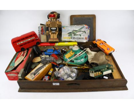 A collection of assorted vintage toys. Including a battery operated robot, clockwork toys and a blackboard, etc. Max. H28cm