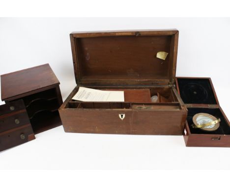 Three early 20th century wooden boxes. Comprising a writing slope, a stationery box and a cased compass, max. L50cm x D26 x H