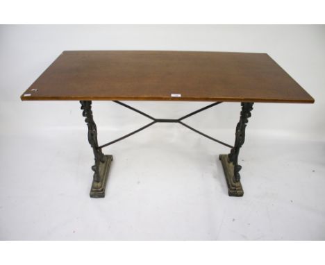 A vintage rectangular pub table. With cast iron supports and stretchers, L121cm x D60cm x H73cm