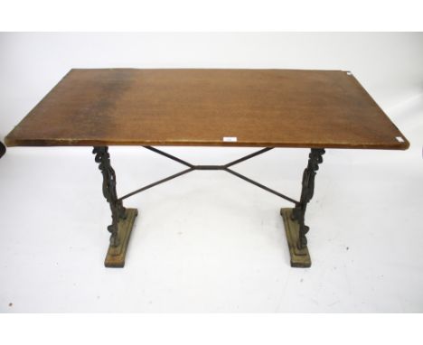 A vintage rectangular pub table. With cast iron supports and stretchers, L121cm x D60cm x H73cm