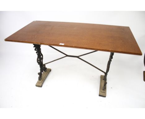 A vintage rectangular pub table. With cast iron supports and stretchers, L121cm x D60cm x H73cm