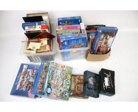 A large collection of jigsaw puzzles, toys and board games. Including jigsaws by Gibbons, Waddingtons and Parker, playing car