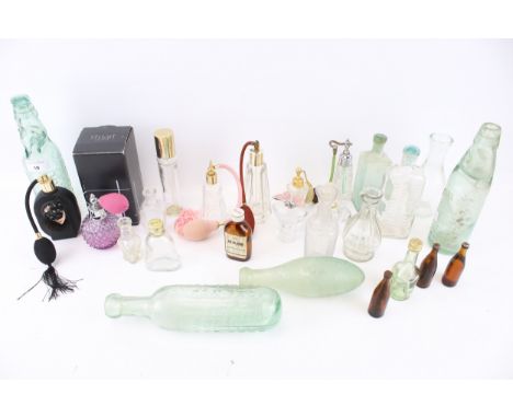 A collection of assorted vintage glass bottles. Including perfume, Codd 'Frome Mineral Water Co. Ltd.', etc. Max. H24cm