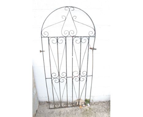 A wrought iron garden gate. L80cm x H179cm