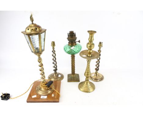 A selection of 19th century and later lamps and candlesticks. Comprising a pair of brass lamp bases with twist columns, H30cm