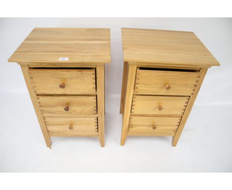 A pair of contemporary light oak bedside chest of drawers. By Willis &amp; Gambier of three drawers with visible joints, L43c