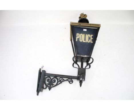 A vintage Police outdoor wall lantern. With guilt metal crown finial and metal bracket, H110cm