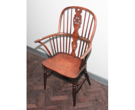 Elm stick and wheelback tub shaped windsor elbow chair 