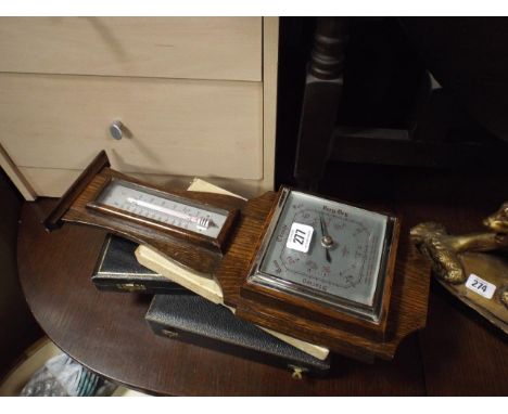 Small 1930's oak barometer/thermometer and some cased cutlery 