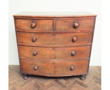 3'6 early Victorian mahogany bow front chest of 3 long and 2 short drawers with bun handles standing on turned feet 