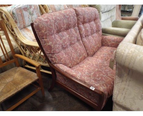 Small mahogany framed Parker Knoll 2 seater sofa with patterned fabric 