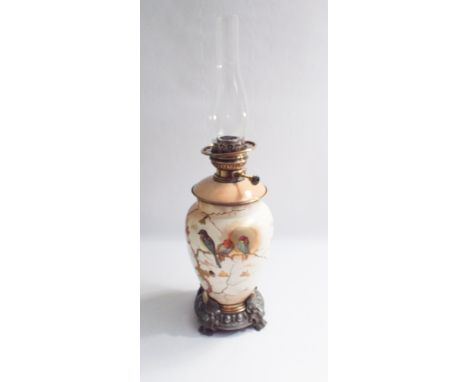 Porcelain oil lamp decorated with bird and glass bowl type shade appx 26" tall 