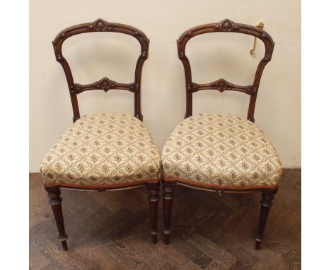 Set of four late Victorian walnut dining chairs with tapestry upholstered seats 