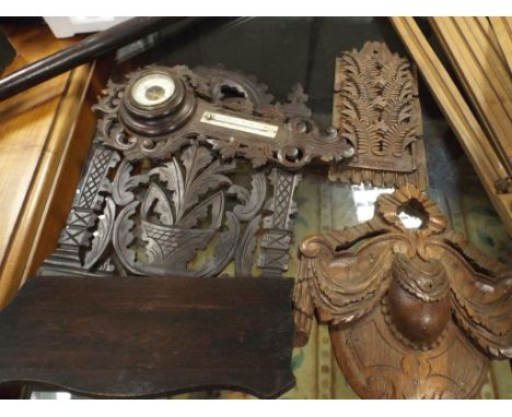 Barometer in carved case, wall bracket, letter rack and a plaque 