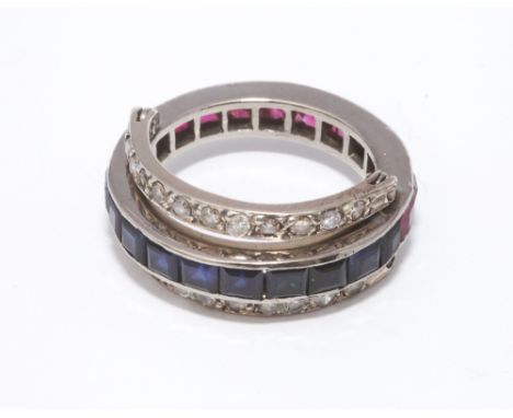 Edwardian day and night eternity ring, one side set with calibre set sapphires, the other with rubies and moveable diamond se