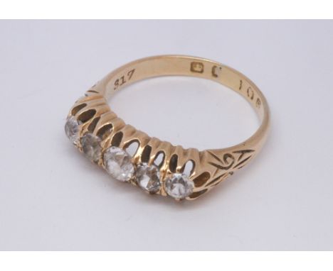 Five stone ring on yellow gold shank, very probably set with white sapphires, shank hallmarks worn. Ring size Q approx.