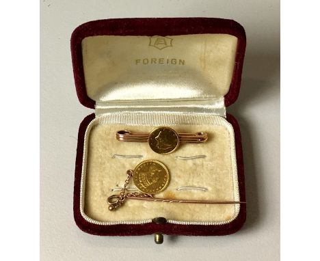 2  American Gold $1 coins. One mounted on a stick pin dated 1859. Other date obscured by bar brooch, possibly 1863. Both set 