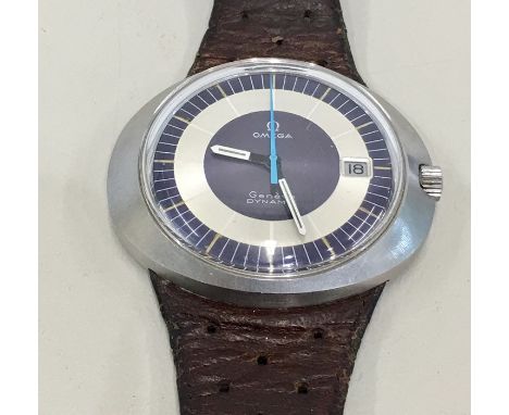 Vintage Omega Geneve Dynamic stainless steel case watch winds and ticks comes on old leather omega strap but no warranty give