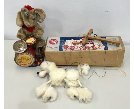 Two vintage toys includes Pelham Puppet Poodle, Dog Boxed 1950s and a Cragstan Melody Band Elephant 