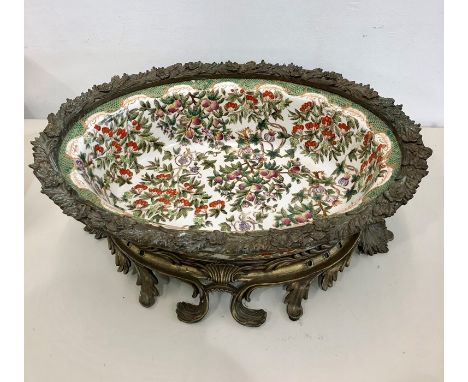 Large Ormolu mount bowl floral enamel painted bowl set in ormolu base and rim measures approx 17.5ins by 13ins and 6.5ins dee