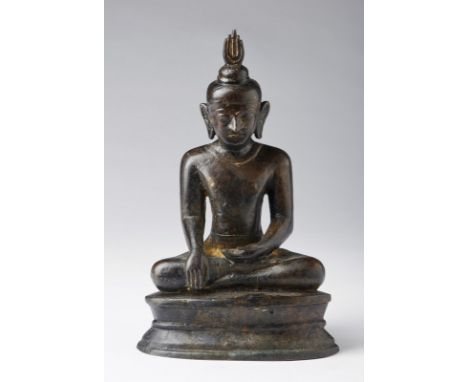 South-Est Asian Art A dark bronze figure of seated Buddha with flaming headdressBurma, Post Pagan, 15th-16th century . . Cm 1