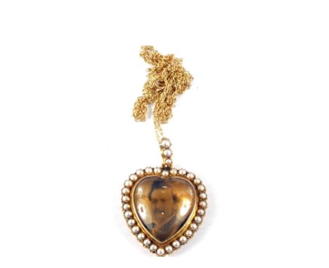 A 9ct Gold Pearl set heart portrait pendant on a 9ct Gold chain
