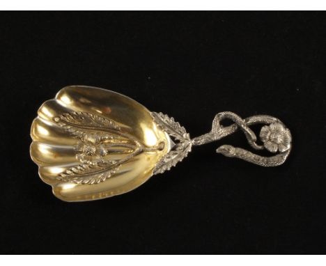 A Victorian Silver caddy spoon with embossed gilded flowers in bowl and handle, Birmingham 1852
