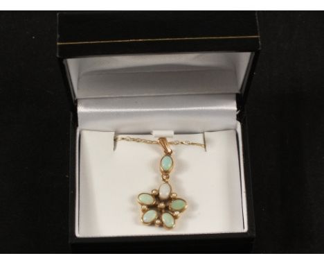 A 9ct Gold necklace with a 9ct Gold Opal and Pearl pendant