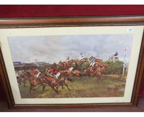 A framed Grand National racing print