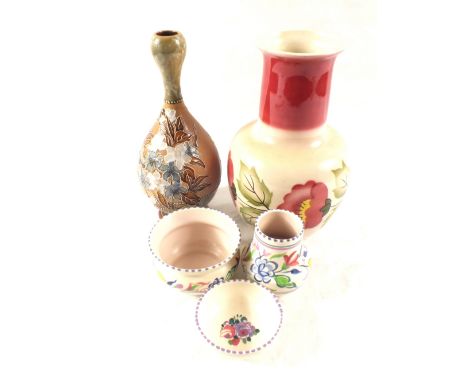 A Radford floral vase, three pieces of Poole Pottery and a Doulton Stoneware vase (repaired)