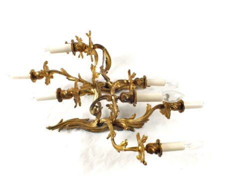 A pair of double and a pair of quadruple Ormolu light fittings