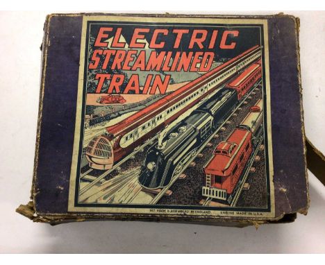 Electric Streamlined Train set in original box with locomotive, three coaches and track set made in England, Engine made in U