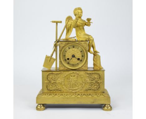 Ormolu Empire clock decorated with a seated putto and relief decor, dial signed Wallem à Gand, under glass dome, 19th century