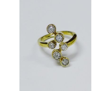 Six stone diamond and yellow metal dress ring 