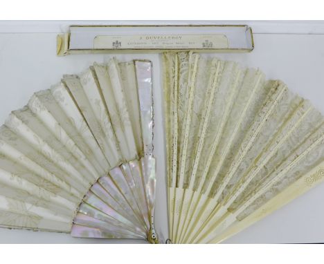Ivory and lace brise fan together with a mother of pearl and lace fan, (2) longest 35cm 
