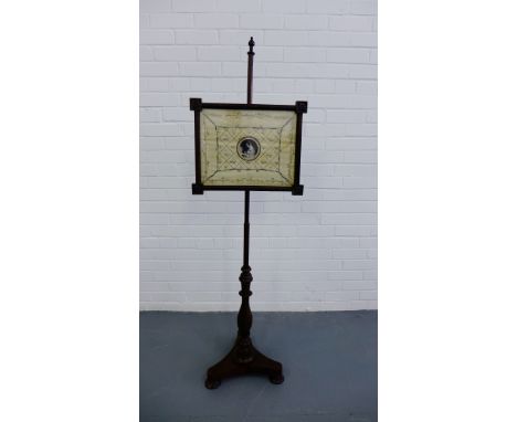 19th century rosewood pole screen with a silk embroidered floral panel, raised on turned support and tripod base, 150cm high