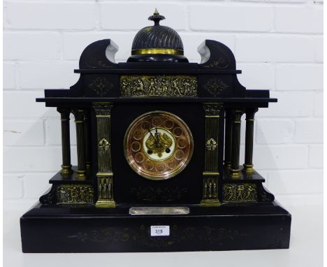 Late Victorian black slate mantle clock, the brass chapter ring flanked by a trio of corinthian columns with classical emboss