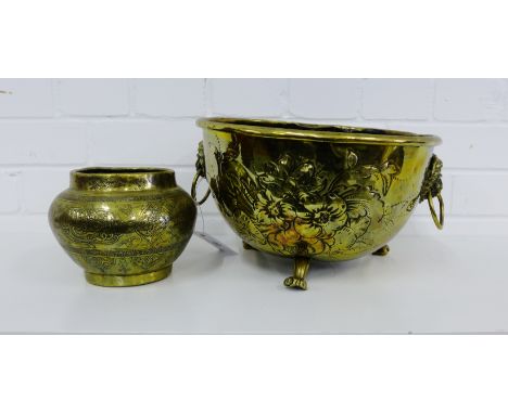 Circular brass floral embossed planter together with an Eastern brass pot (2) 