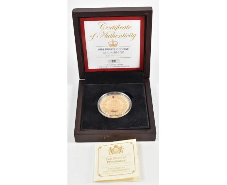 
A 22ct gold proof coin medallion commemorating the birth of Prince George 22 July 2013 complete in presentation case. The ob