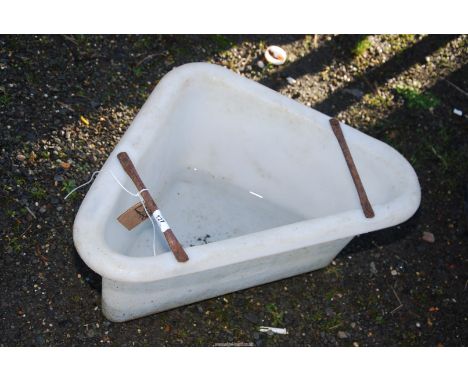 A plastic corner feeder/basin.