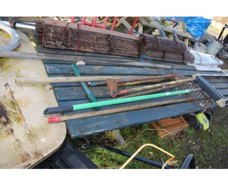 A quantity of tools, rakes, hoes, garden claw, trowels etc.