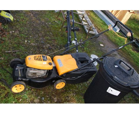 A Maculloch M40/450C mower, two stroke petrol engine, with grass box.