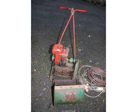A Suffolk cylinder mower, engine turns.